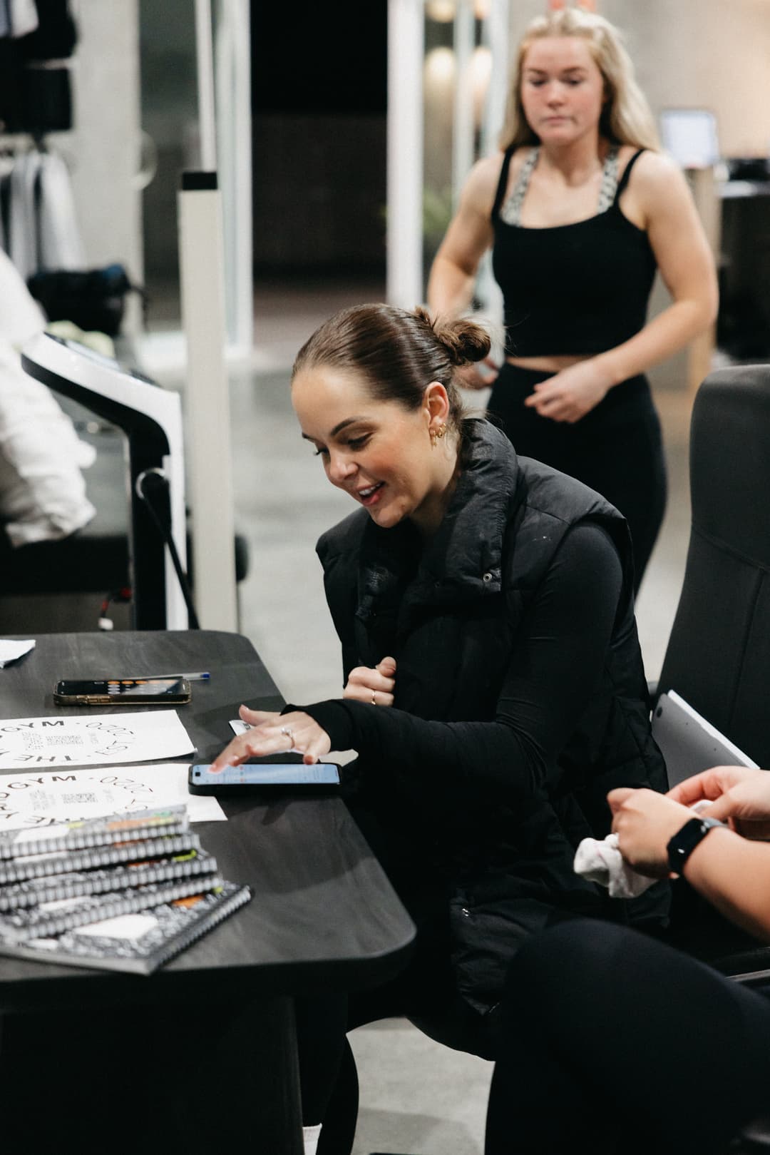 Staff member providing nutrition guidance to a member during a 6-week challenge at The Yard Gym Wollongong. 